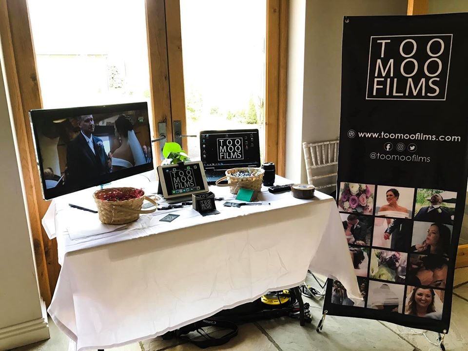 Photo of Too Moo Films display table at a Wedding Open Day. Too Moo Films are a wedding videography company based in Longford in Gloucestershire.