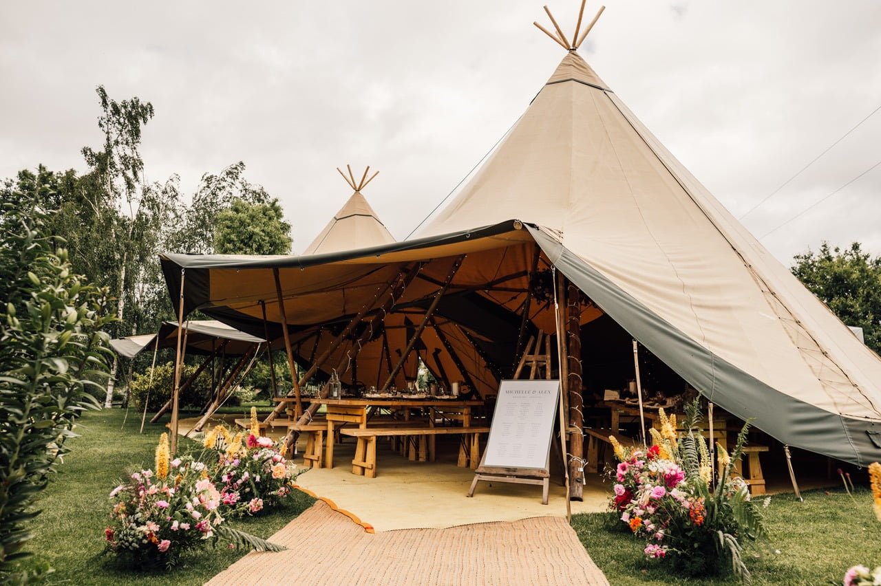 Photo of 2 Tipis with the front raised by Simon Biffen Photography.